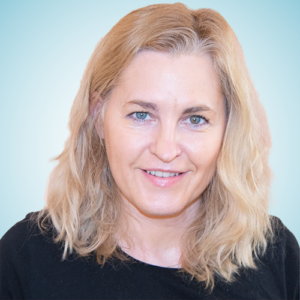 Woman smiling, professional headshot for About section.